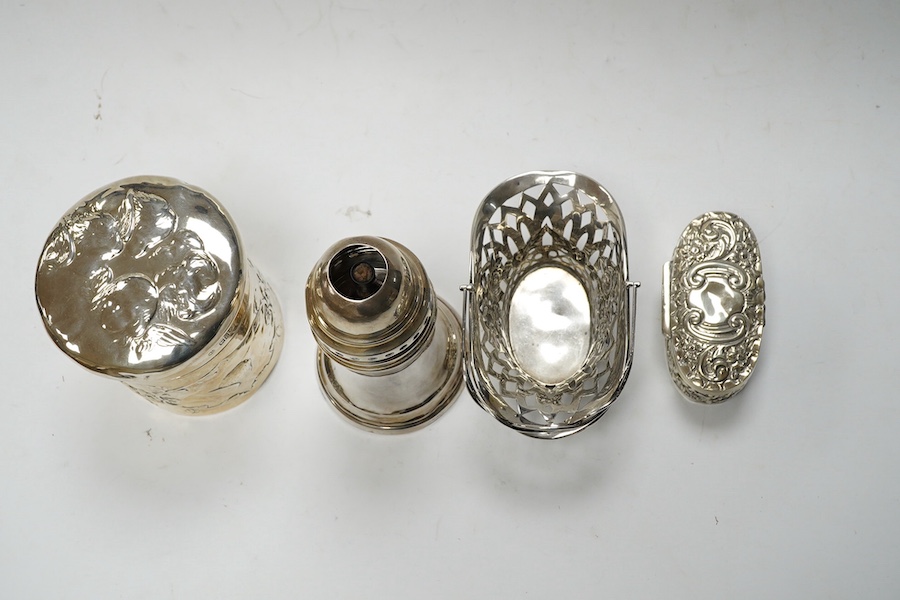 An Edwardian silver 'Reynold's Angels' silver canister, William Comyns, London, 1902, 90mm, together with a silver table perpetual lighter, silver bonbon basket and silver ring box. Condition - poor to fair